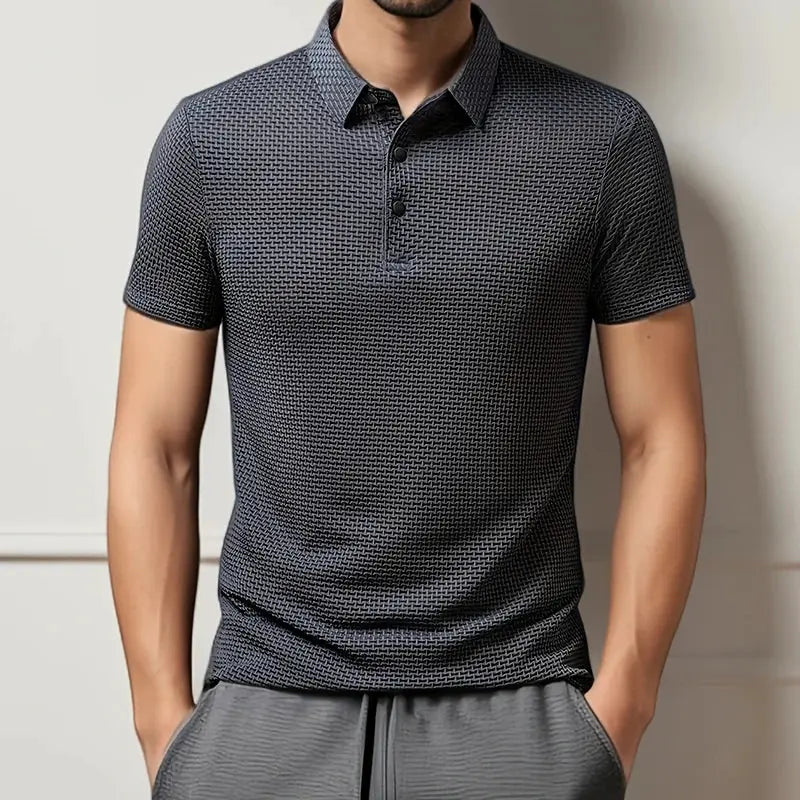 Men's polo shirt by Simples Market; short sleeves, dark gray with a subtle geometric pattern.