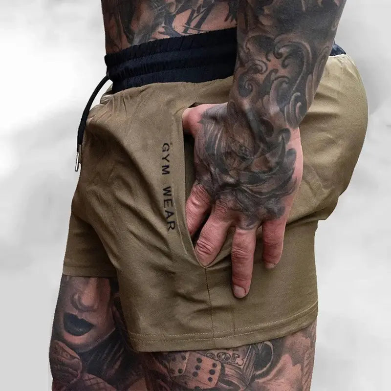 Men's gym shorts in tan, light-weight quick-drying fabric with drawstring and side pocket.