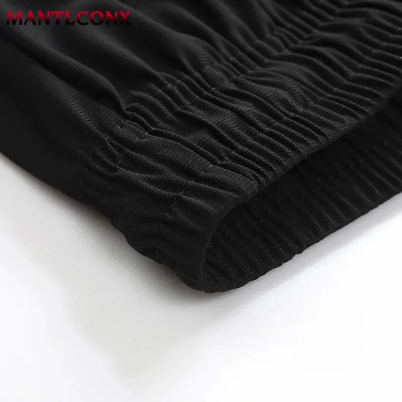 Men's black sports shorts MANTLCONX with elastic cuffs for running and gym