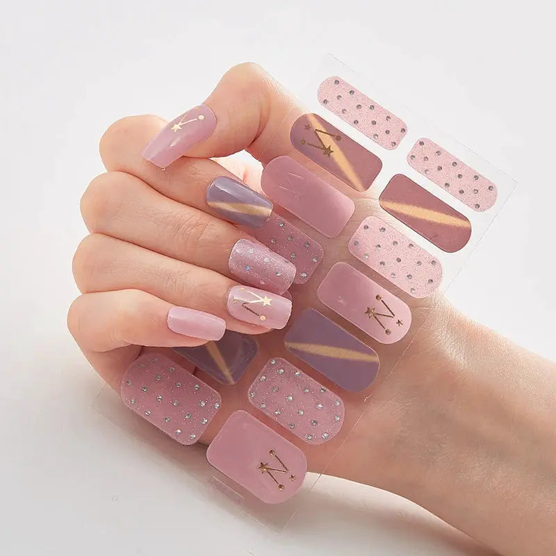 Full-cover nail sticker sheet by Simples Market in pink and mauve glitter with gold diagonal stripes