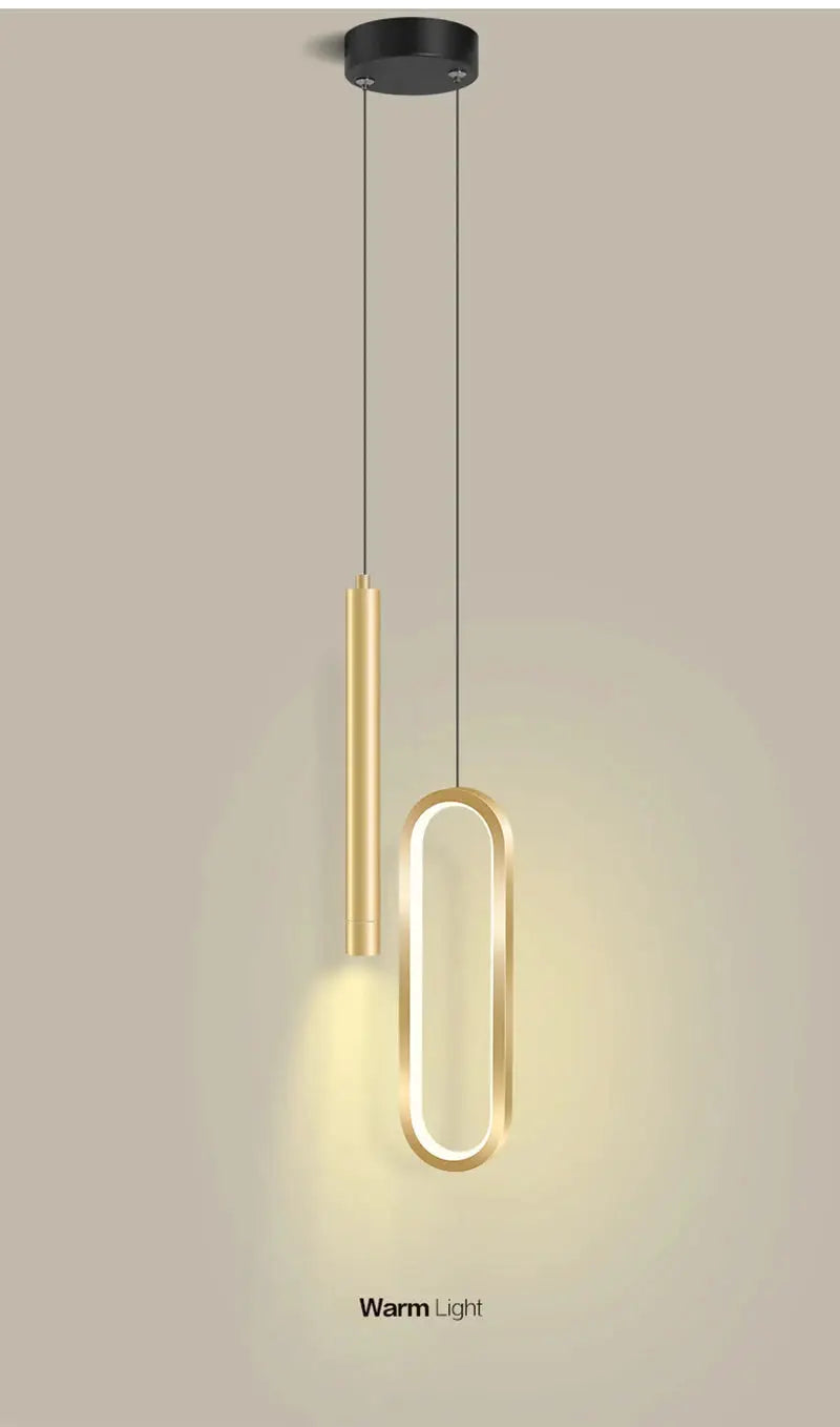Nordic LED pendant light by Simples Market, gold finish dual pendant with oval ring.