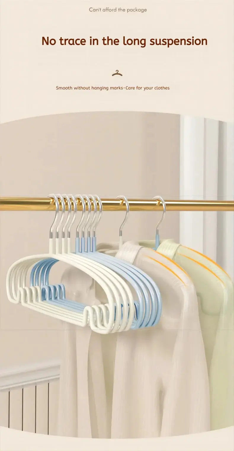 10-pack plastic non-slip clothes hangers in white and light blue on a gold closet rod with garments