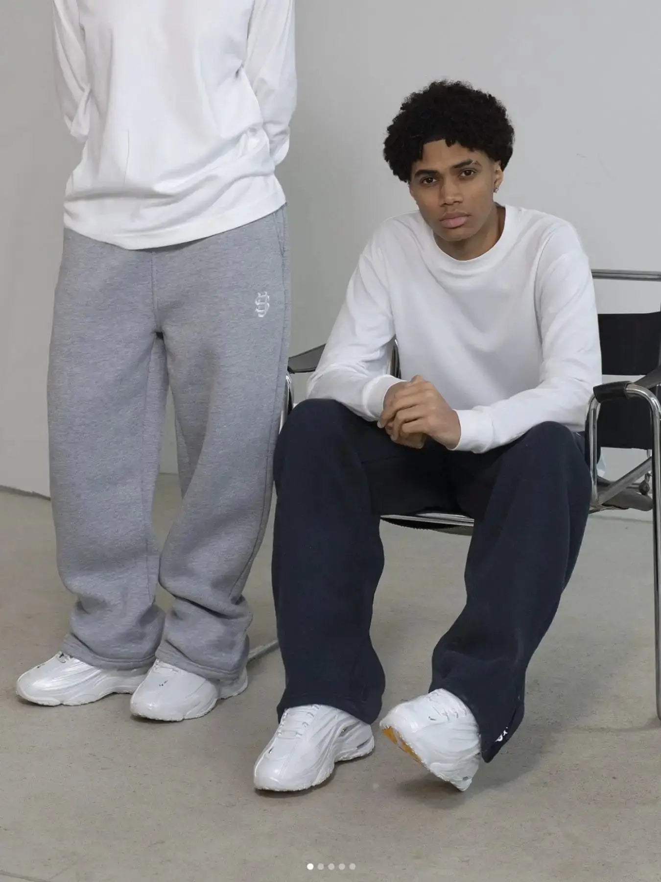 Men's gray jogger pants with small white embroidery on leg, streetwear style