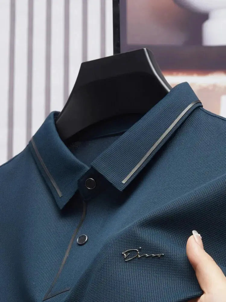 Men's blue polo shirt by Simples Market with textured fabric, polo collar, and chest logo.