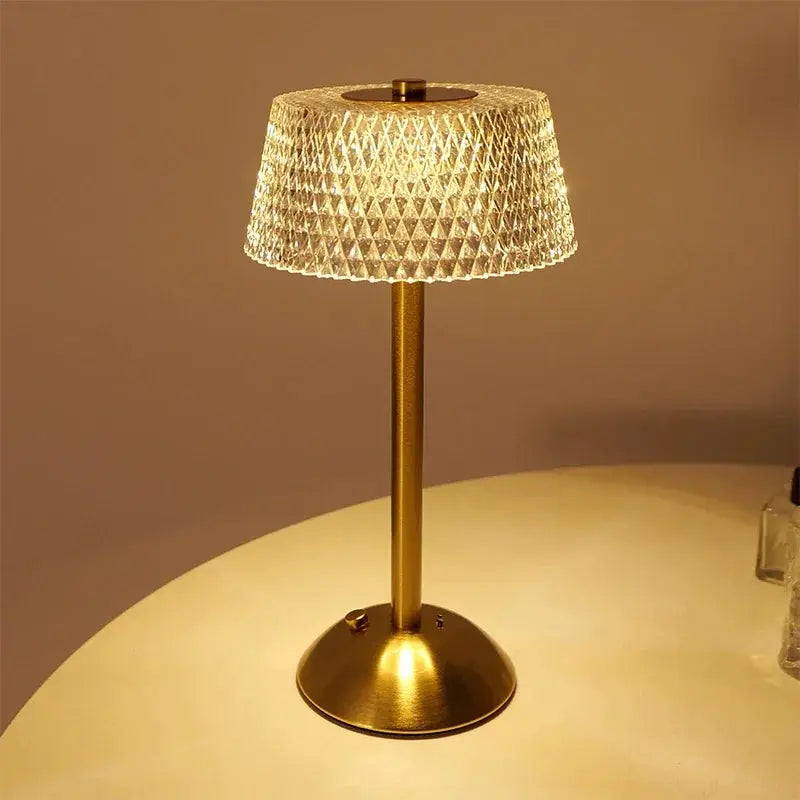 Gold metal table lamp with a diamond-pattern glass shade; rechargeable LED night light for bedside or study.