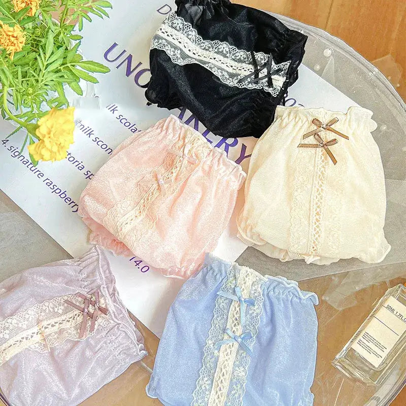 Five-piece set of women's ice-silk panties with lace trim and bows in black, cream, pink, lavender, and blue.