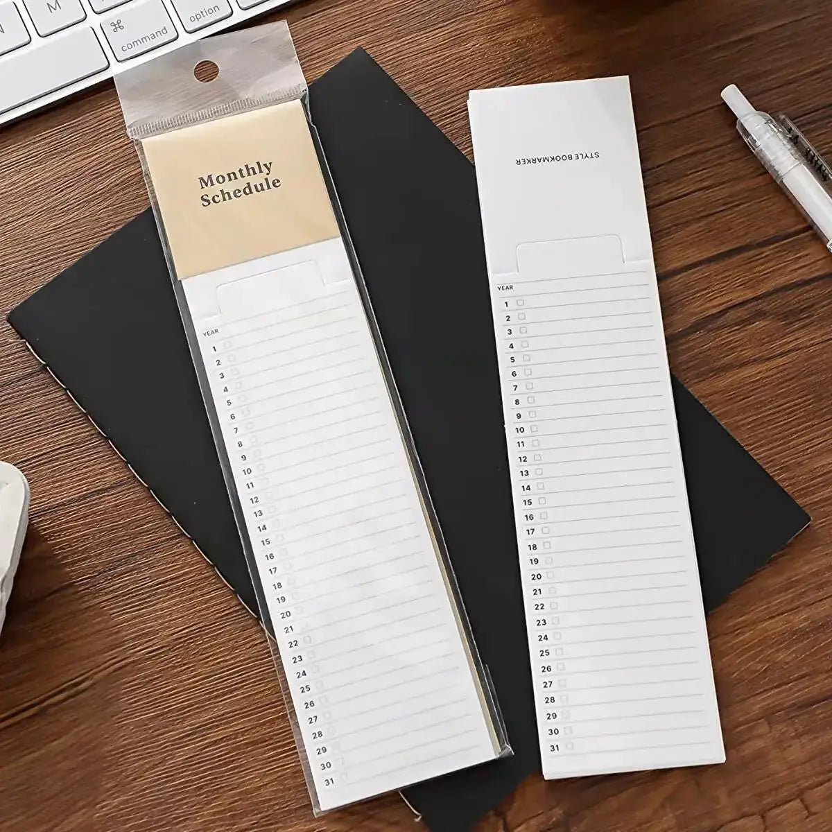 Simples Market MINKYS bookmark-style memo pads, two long white weekly planner sheets with numbered dates (1–31) and checkboxes