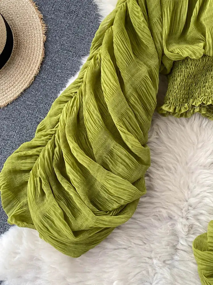 Chiffon blouse in lime green with draped fabric and puff long sleeves.