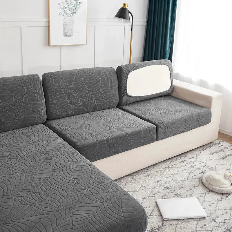 Waterproof stretch sofa cushion cover in gray by Simples Market, leakproof couch protector for dogs on a sectional.