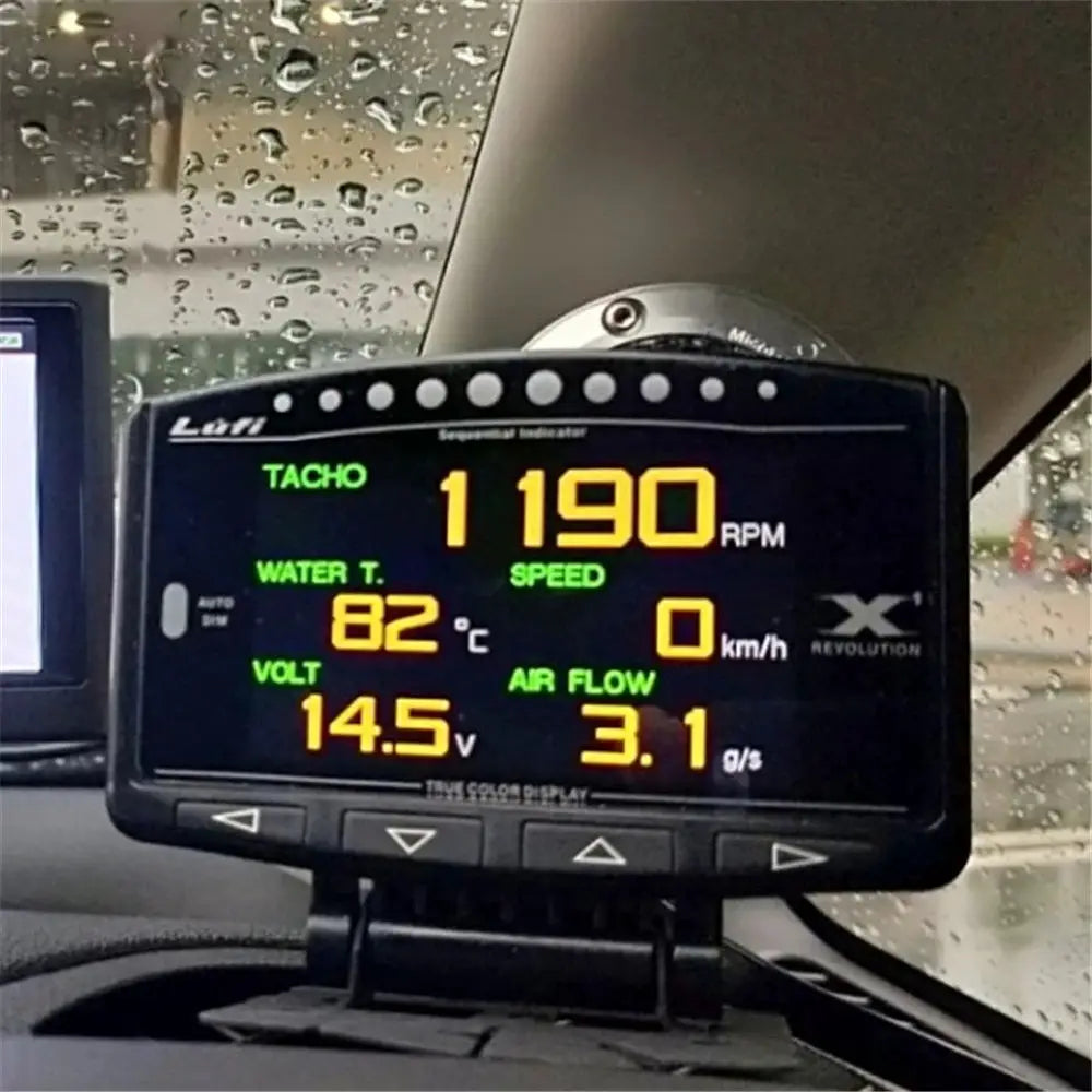 Lufi X1 Revolution OBD2 digital car gauge, black display with green and orange readouts showing RPM, water temperature, voltage and air flow