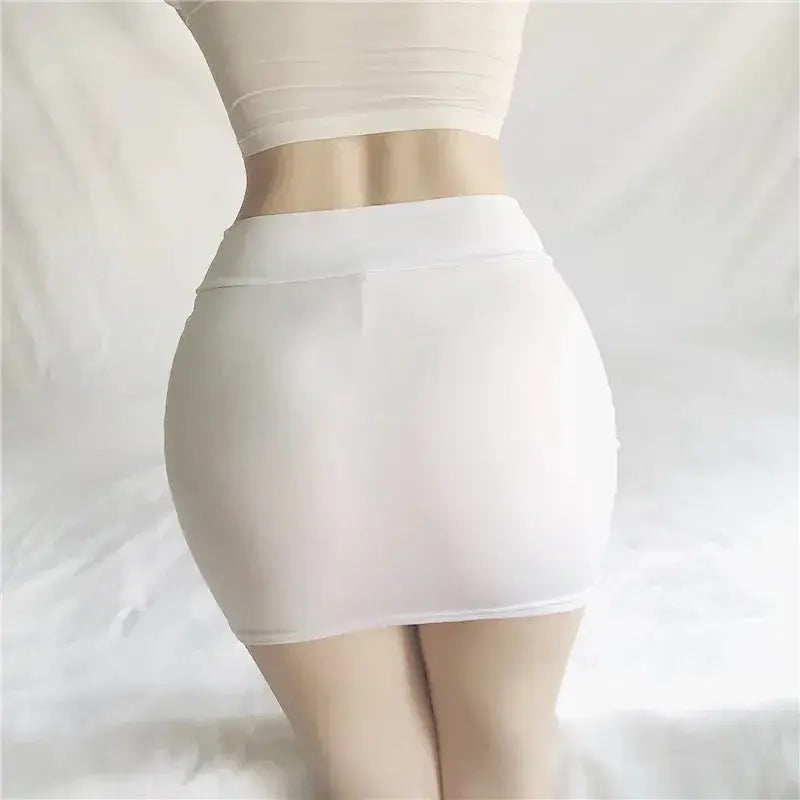 Women's white solid-color micro mini skirt, hip-hugging fit, back view.