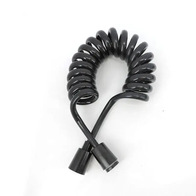 Black coiled handheld bidet spray hose with dual-end fittings