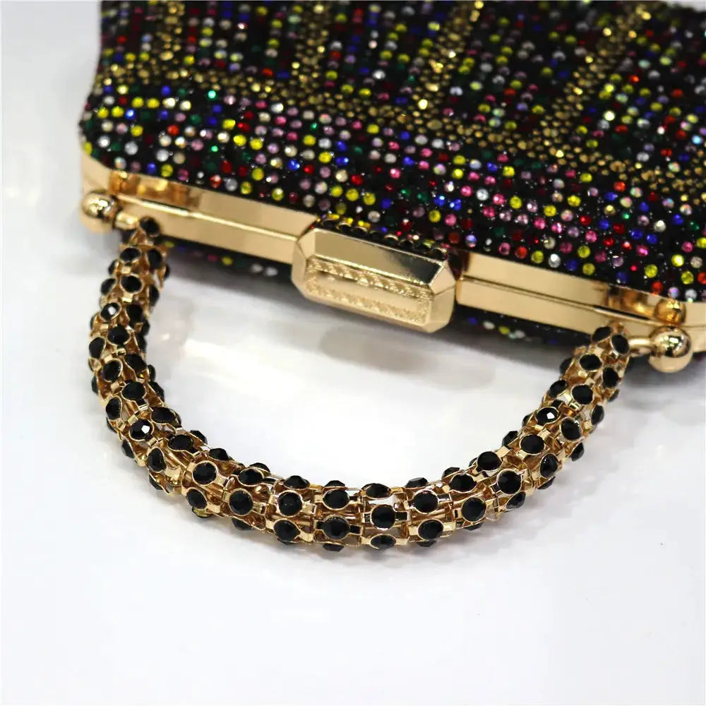 Rhinestone evening clutch with multicolor stones on black body and gold-tone chain handle