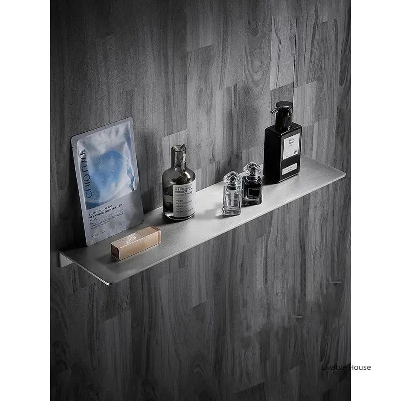 304 stainless steel bathroom storage rack, brushed chrome corner shelf with toiletries by Simples Market.