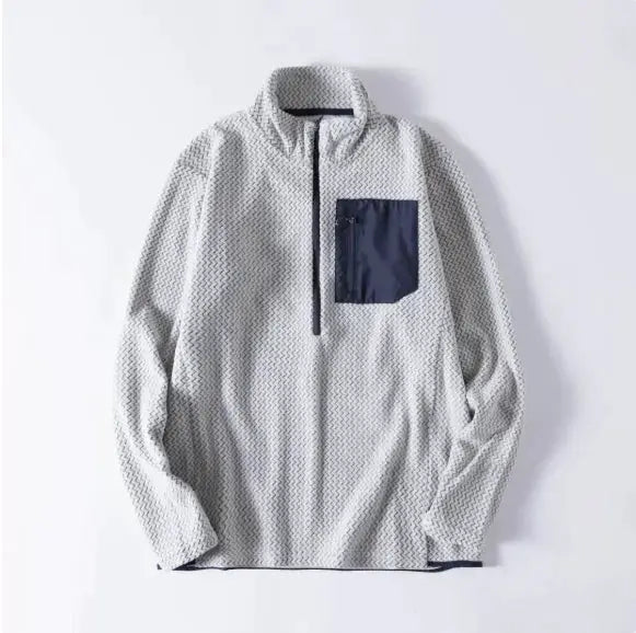 Fleece sweatshirt, unisex, light gray with navy chest pocket and navy half-zip placket.