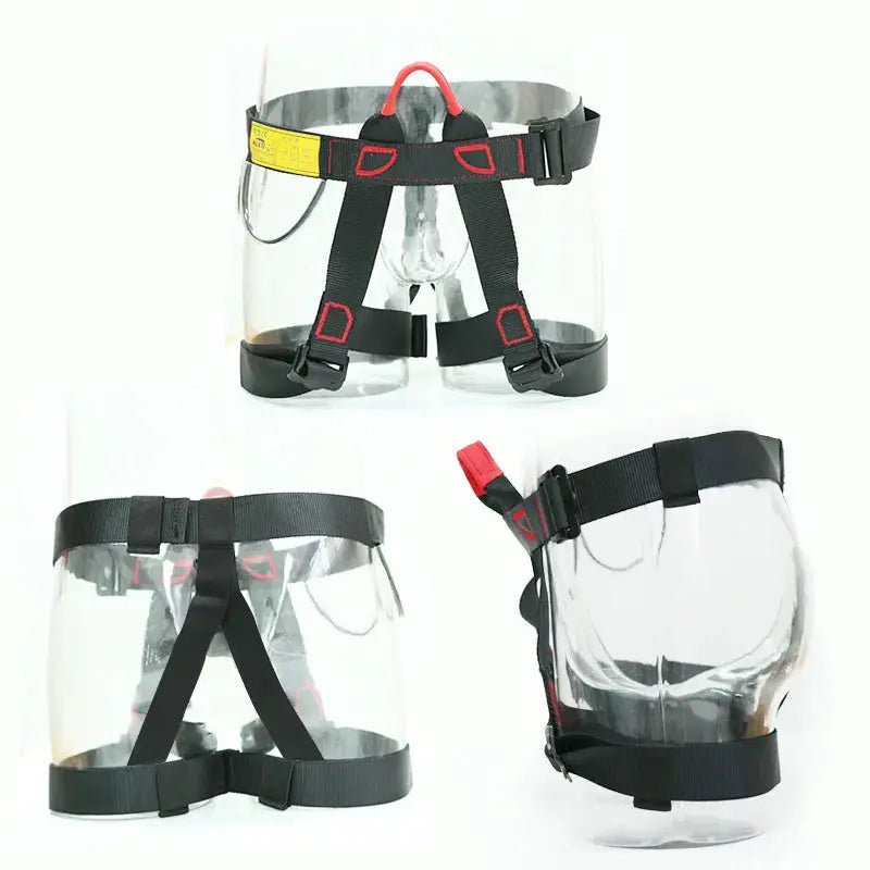 Rock climbing safety harness with clear chest shield, black webbing and red accents.