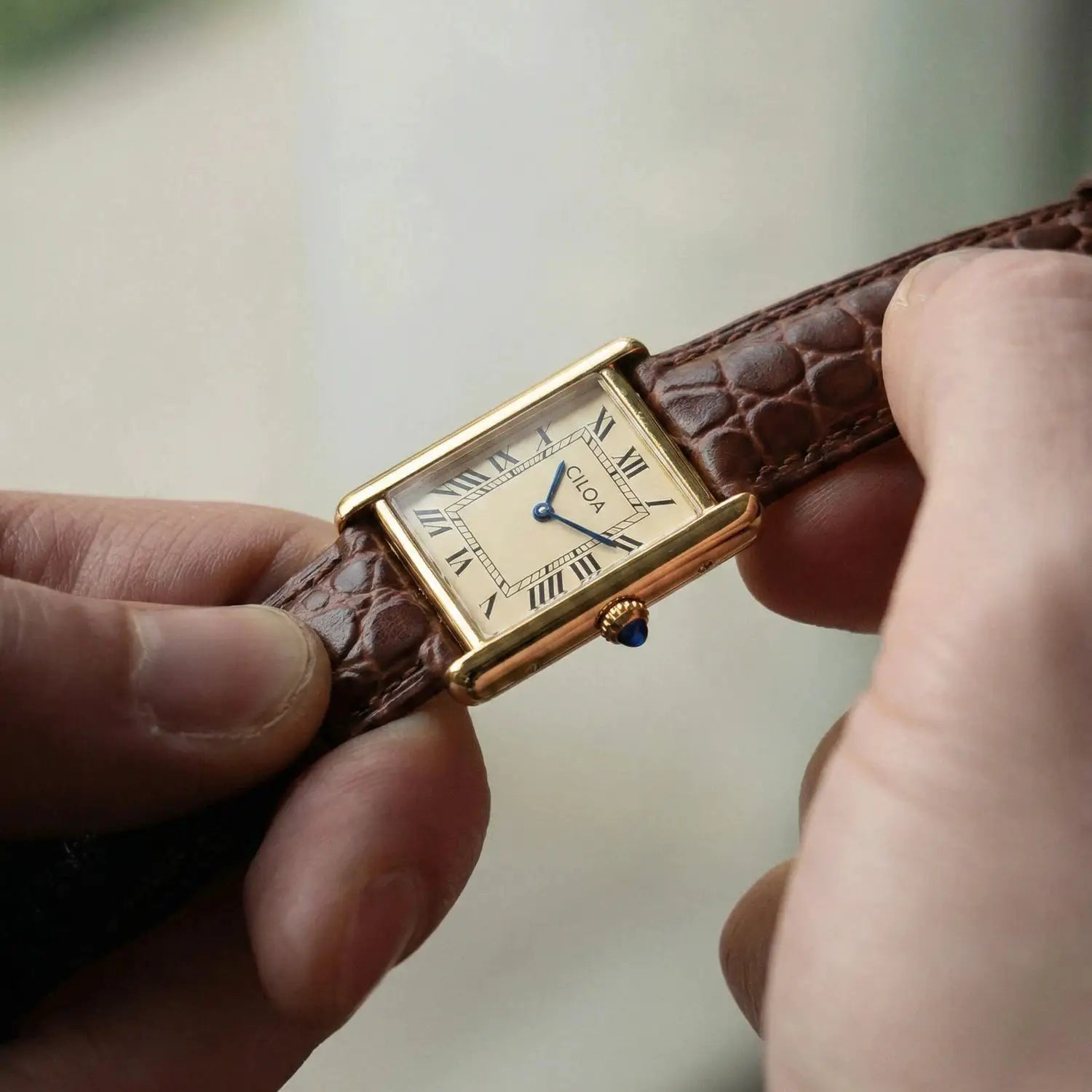 CILOA men's luxury retro square watch; gold case, cream dial, blue hands, brown leather strap.