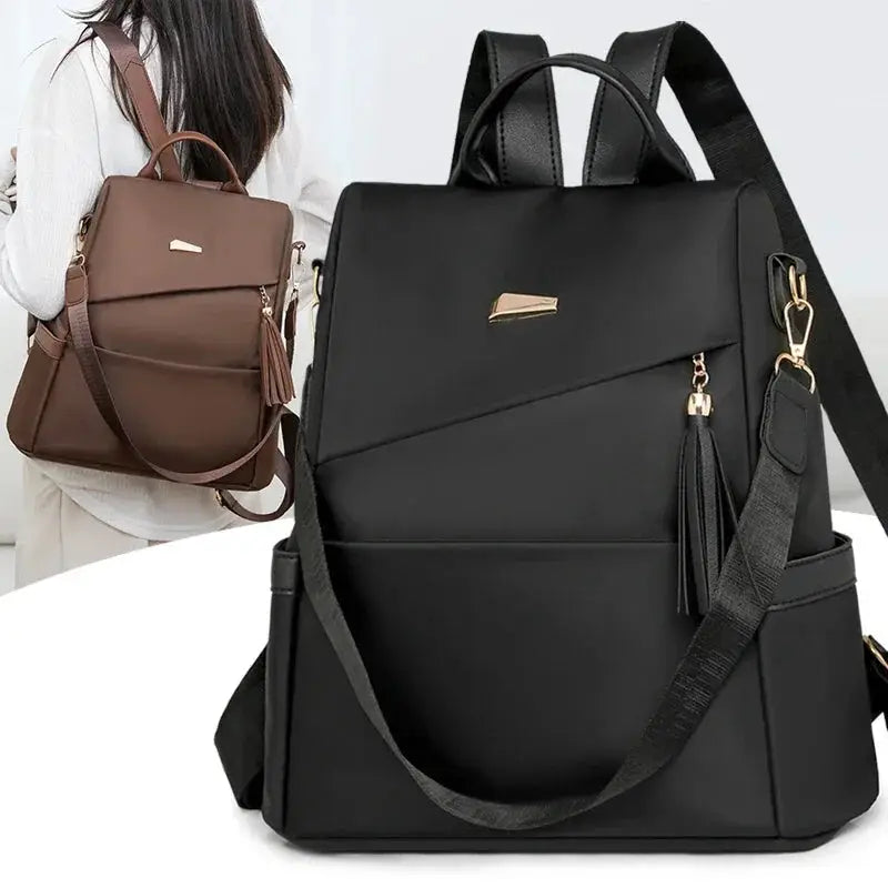 Fashion Women’s nylon anti-theft backpack by Simples Market, black with tassel; brown version shown.