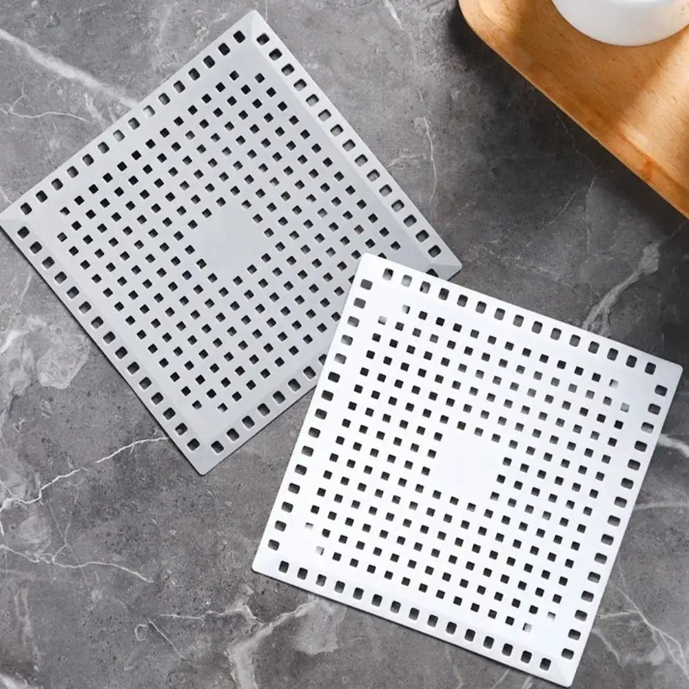 Two-pack square stainless steel drain strainers with perforated grids