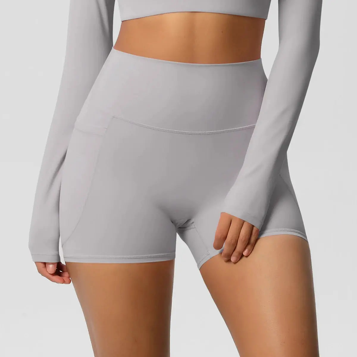 Women pocketed yoga shorts by Simples Market, high-waist, light-gray, quick-dry, squat-proof