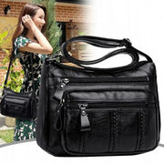 Women's black PU leather multi-pocket shoulder bag with front zip pockets and crossbody strap