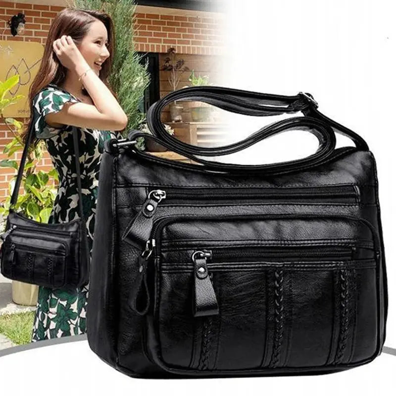 Women's black PU leather multi-pocket shoulder bag with front zip pockets and crossbody strap