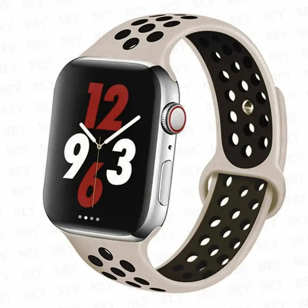 Silicone sport strap for Apple Watch; beige band with black perforations, fits 38–45mm Apple Watch sizes.