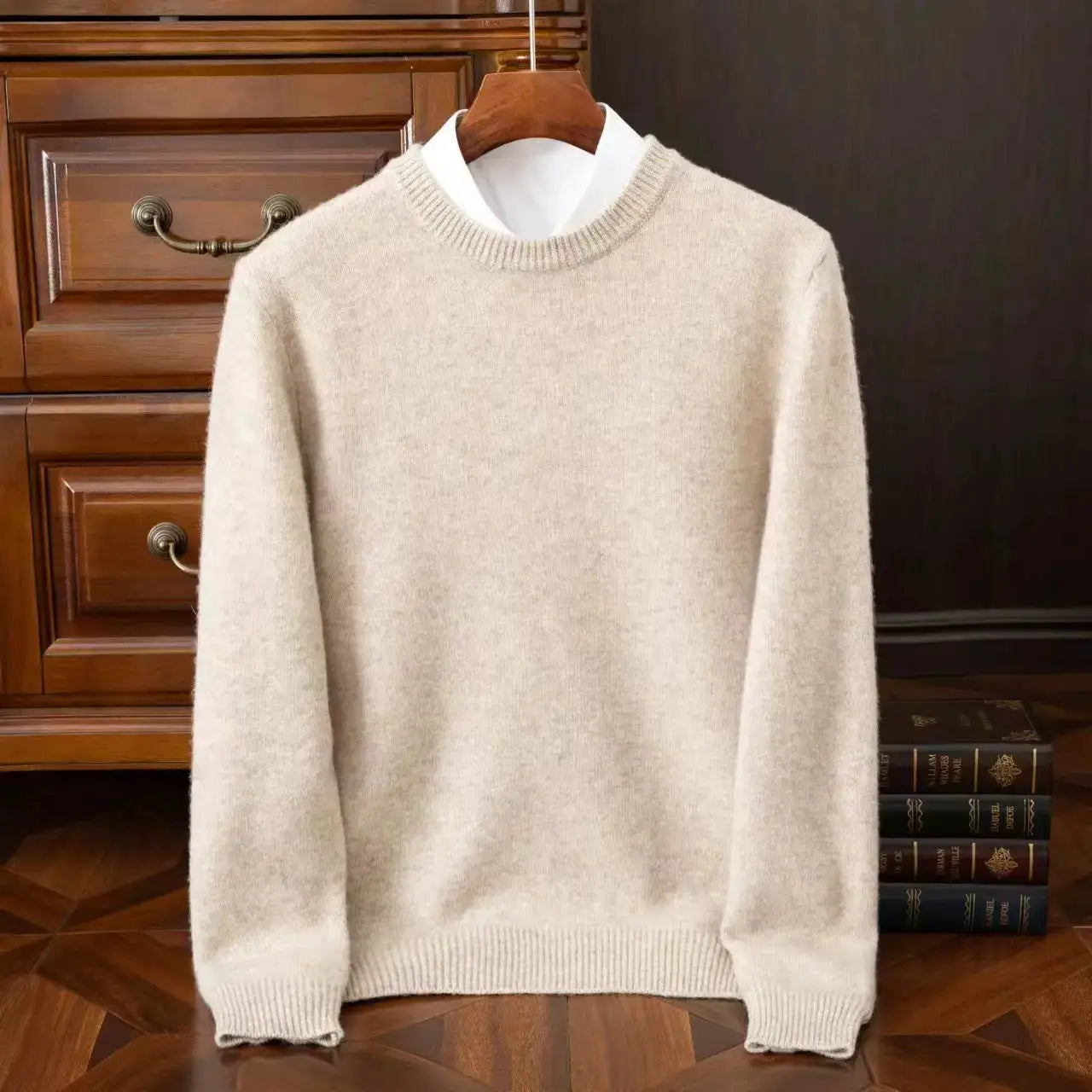 Cashmere O-neck sweater for men, beige oversized knit with ribbed cuffs and hem on a hanger.