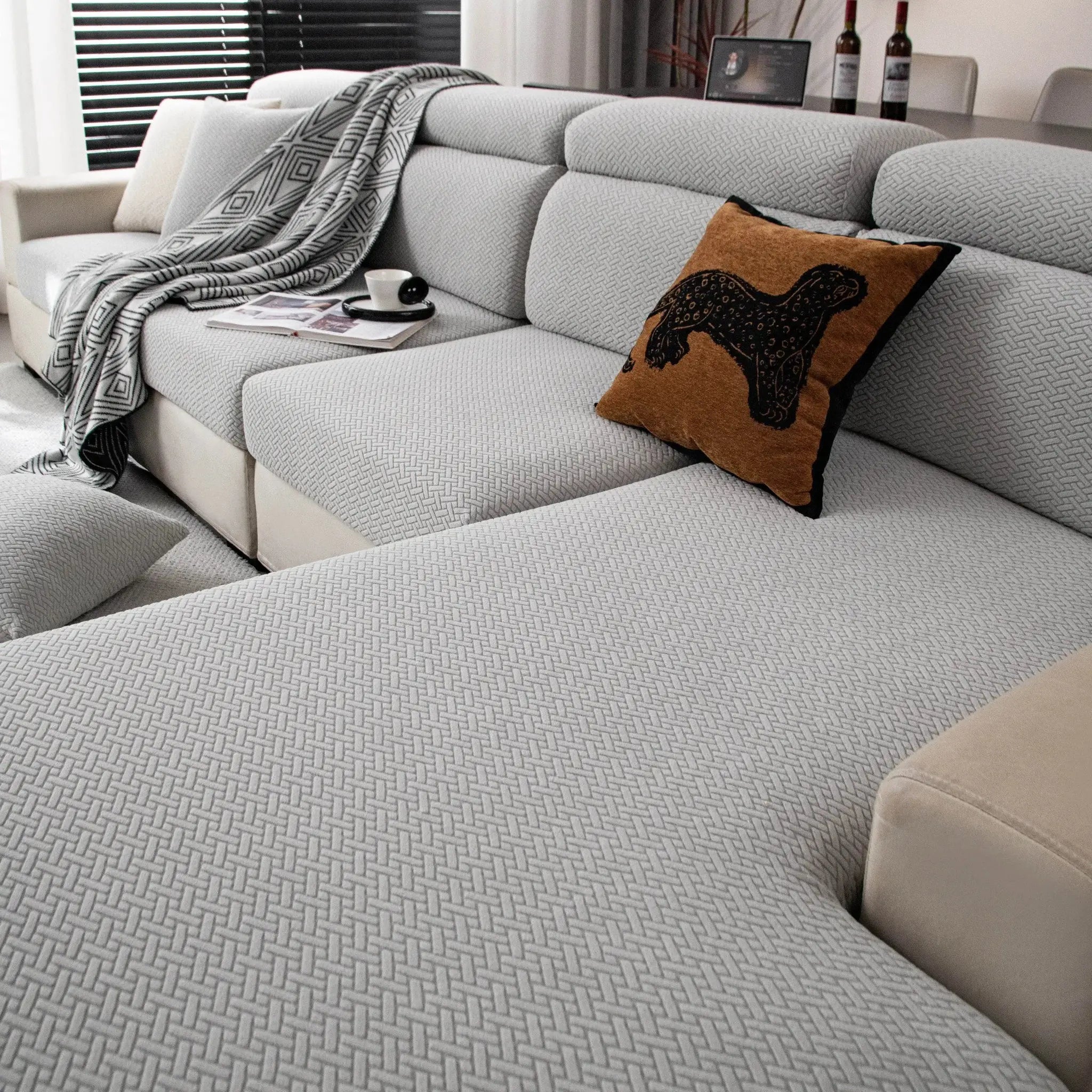 Stretchy polar fleece sofa cover for 1 to 4 seat sofas; light gray with geometric weave