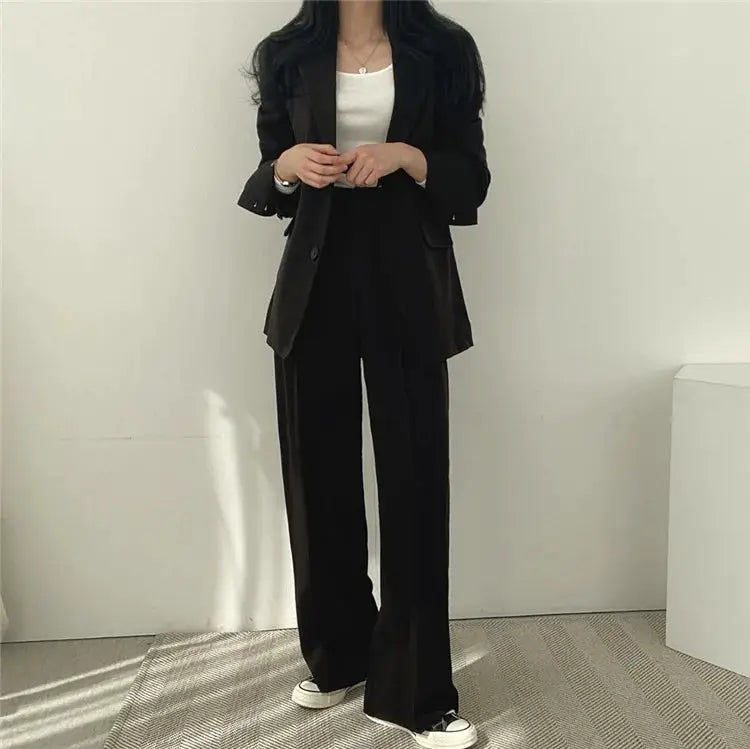 Women's black blazer and wide-leg pants 2-piece suit set, casual fall outfit.