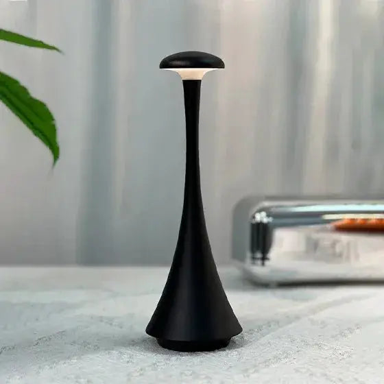 Black matte mushroom table lamp, USB-C rechargeable wireless touch night light for home and hotel.