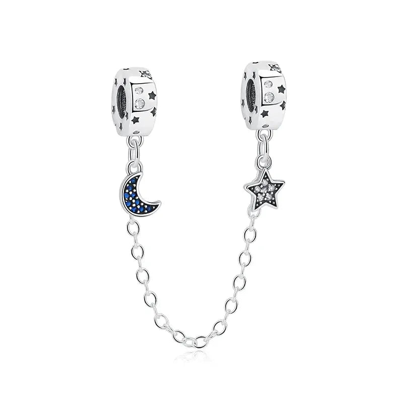 Sterling silver bracelet charms by Simples Market; moon and star pendants with blue and clear zircon, 2 pieces
