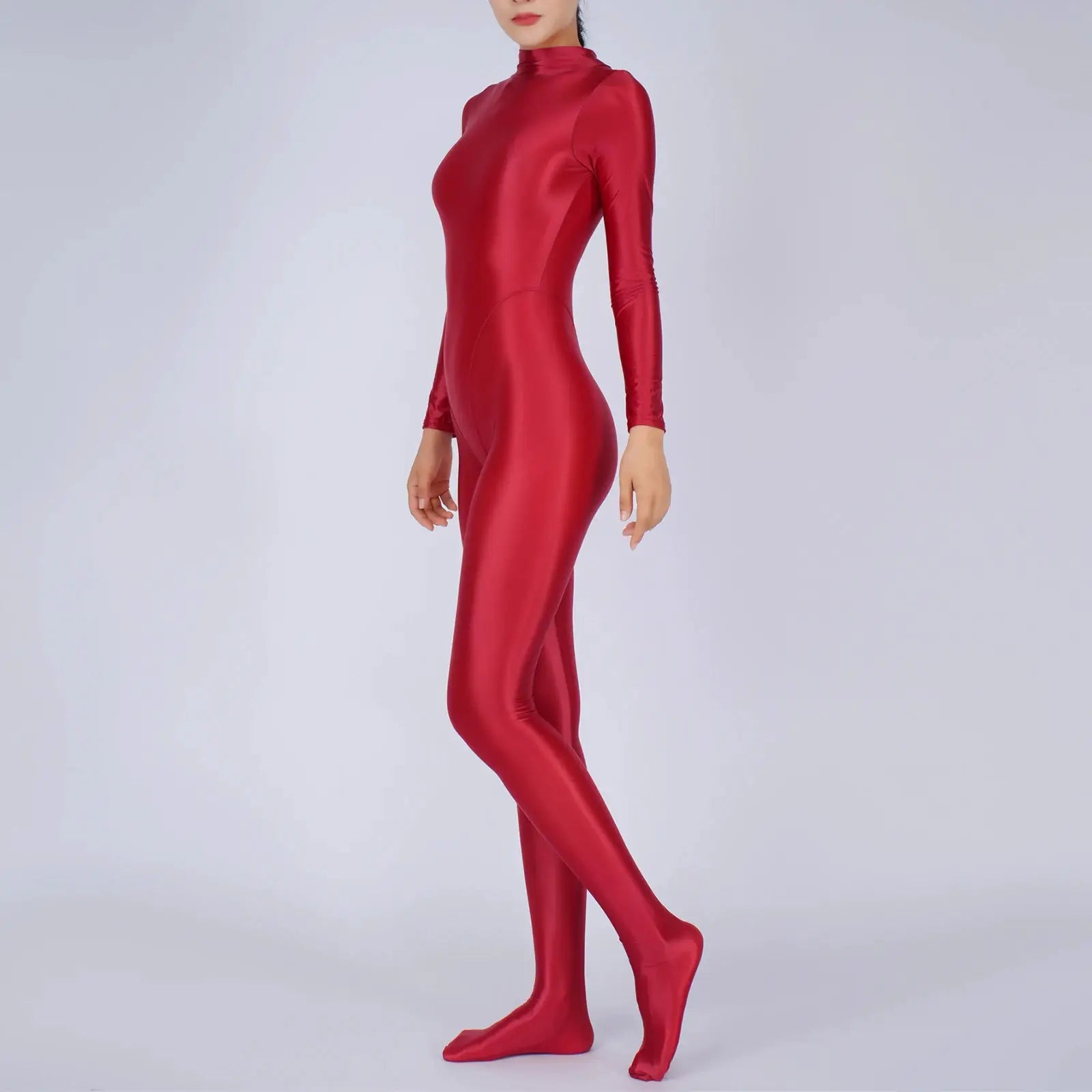 Simples Market red full-body jumpsuit with long sleeves and footed legs in shiny stretch fabric