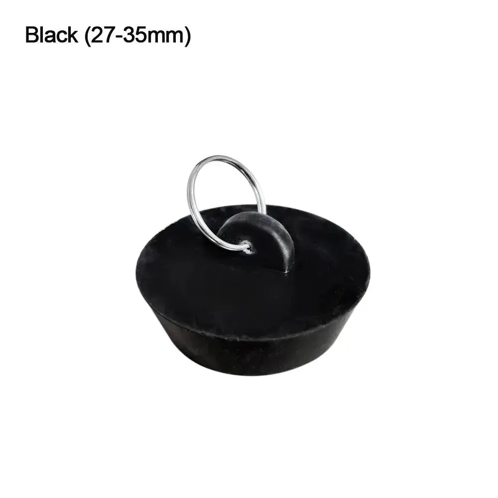 Sink drain plug, black rubber with metal ring, fits 27–35mm.