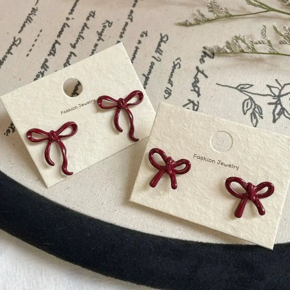 Red bowknot stud earrings, retro ballet ribbon style for women and girls; 2 pairs on white display cards