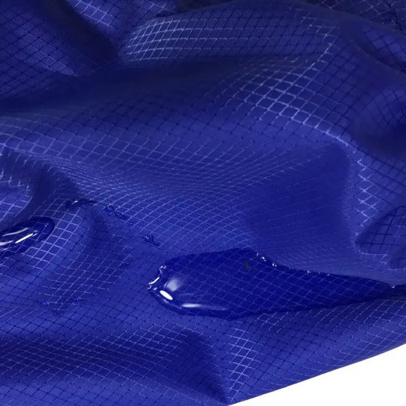 Blue legging gaiter with buckle strap; waterproof ripstop grid fabric.