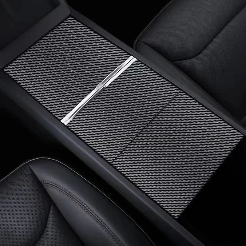 Center console cover protector for Tesla Model 3 with black carbon-fiber film and silver trim.