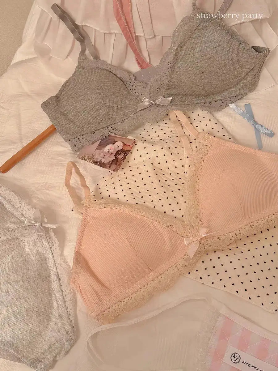 Three lace triangle-cup bras in gray, blush pink and ivory with delicate trim