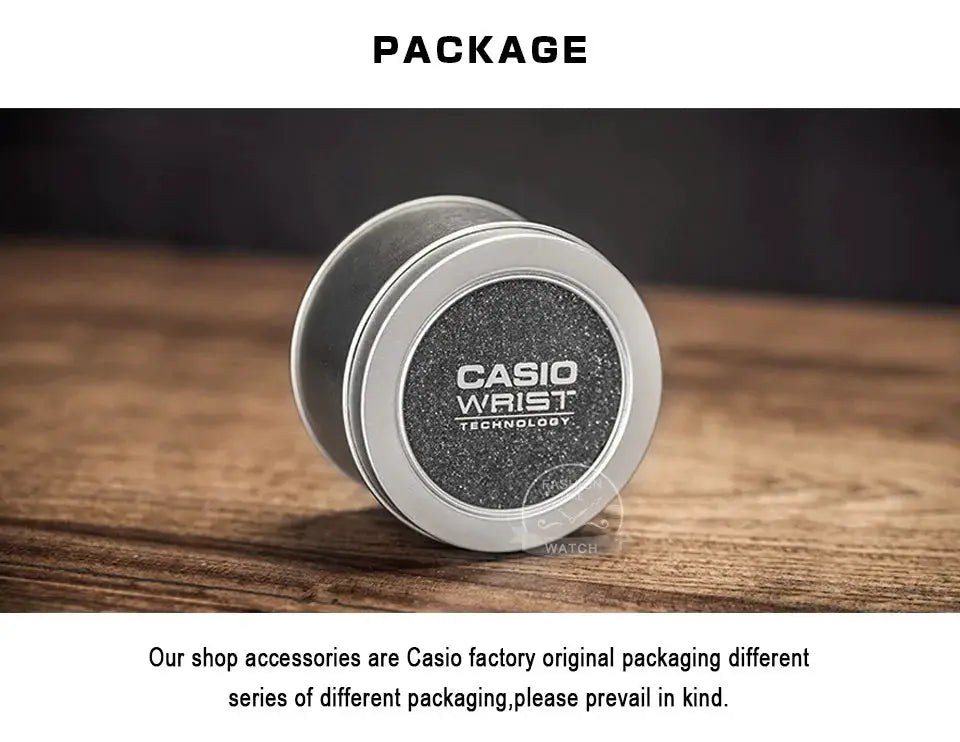 Casio wristwatch packaging tin; round silver metal box with a black speckled lid and Casio logo