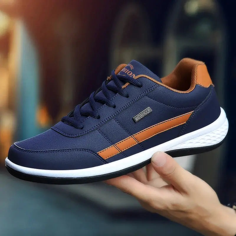 Simples Market leather men’s sneakers, navy blue upper with brown stripe and white sole.