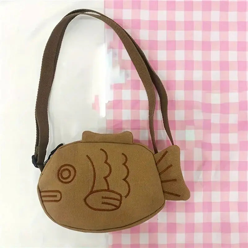Fish-shaped canvas messenger bag, brown with embroidered fish motif and zippered closure