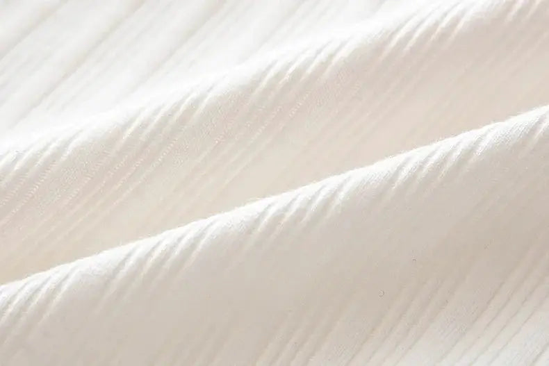 Pure cotton fabric close-up in white with a ribbed texture