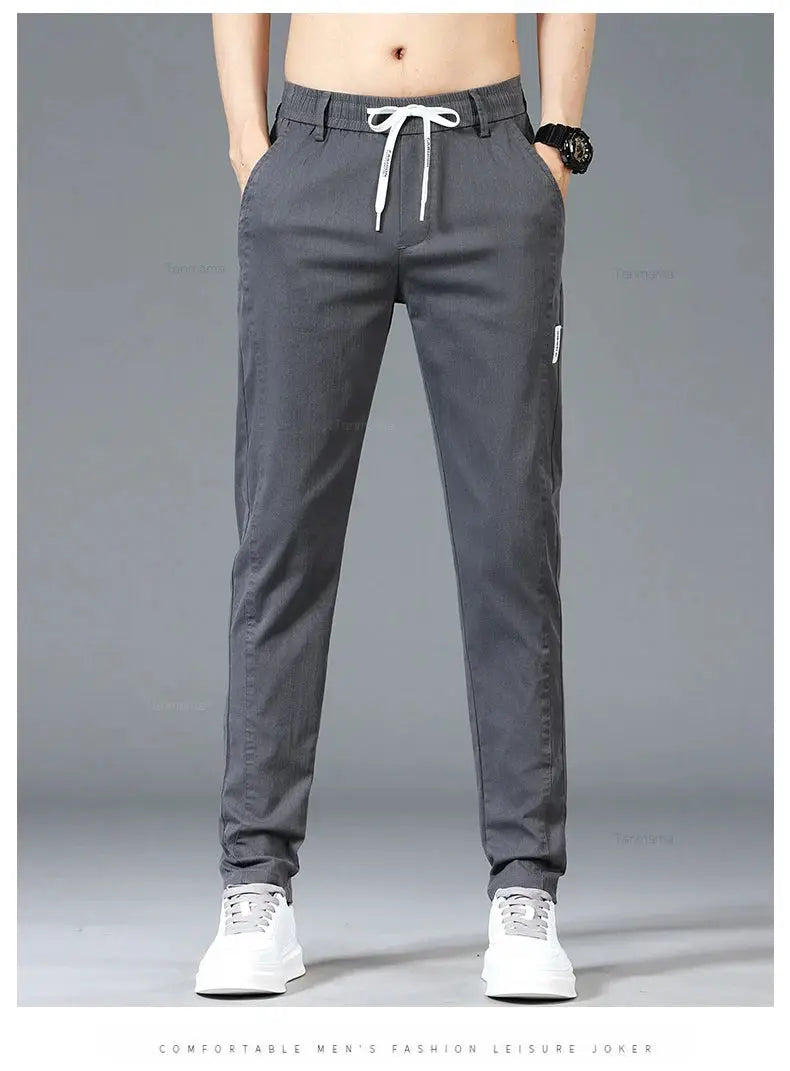 Men's casual pants with elastic drawstring waist in gray, slim straight fit, side pockets.