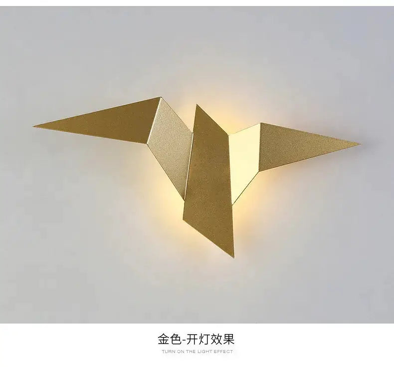 New Nordic LED bird wall lamp in gold with geometric angular panels and warm light.