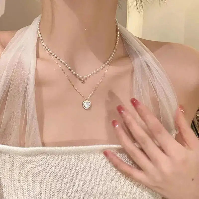 New Beads women's pearl choker necklace with gold-tone chain and heart pendant, dual-layer K-pop collar jewelry.