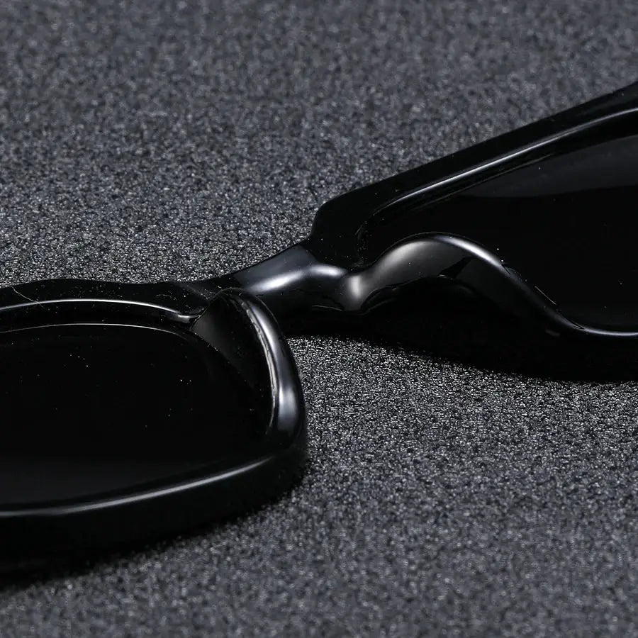 Men's fashion sunglasses with black square frames and retro rivet detail