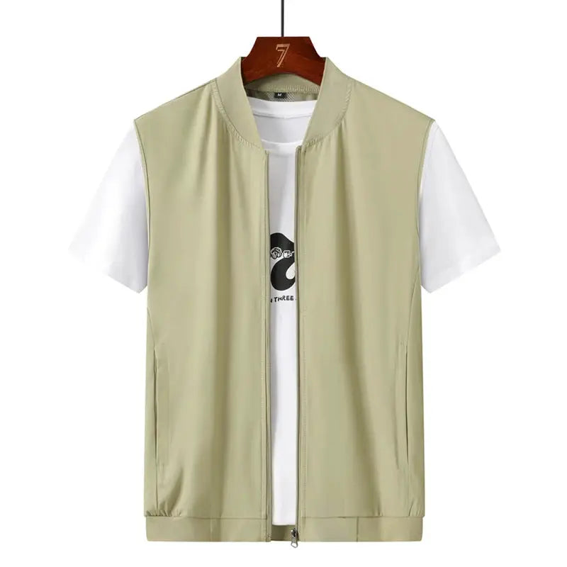 Light beige sleeveless vest with front zipper over a white T-shirt, casual outdoor jacket on hanger.