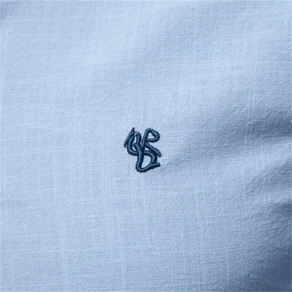AIOPESON shirt in light blue with small dark-blue embroidered logo