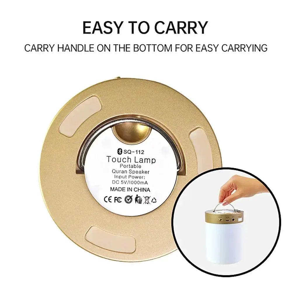 Portable LED night-light Bluetooth speaker with gold base and white body, carry handle