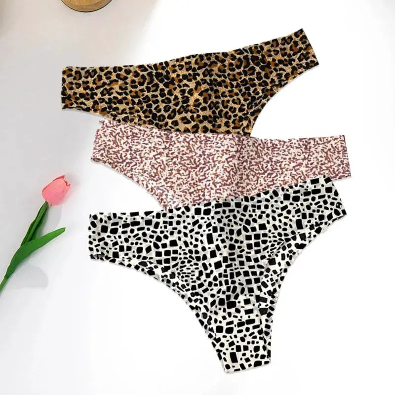 3-pack thong underwear set in leopard, pink speckle, and black-and-white mosaic prints; seamless ice-silk briefs
